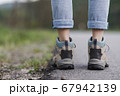 Legs walking along the roadside 67942139