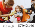 Happy little girl during dental check up 67942140