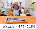 Dentist tools near little patient 67942154