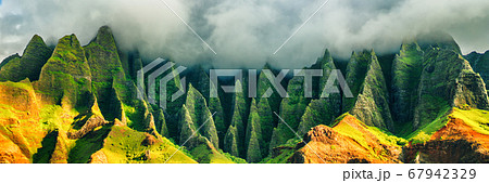Hawaii Kauai mountains nature travel landscape. Na Pali coast, Kauai, Hawaii of Napali coastline in Kauai island, Hawaii, USA. Panorama banner copy space on mountains Hawaii Kauai mountains nature travel landscape. Na Pali coast, Kauai, Hawaii of Napali coastline in Kauai island, Hawaii, USA. Panorama banner copy space on mountains 67942329