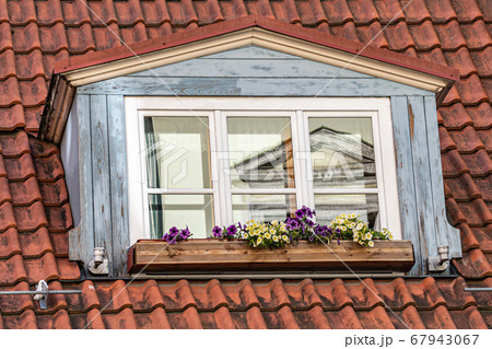 Skylight on a tiled roof of a traditional European 67943067