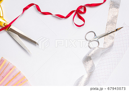 needlework golden scissors ribbons fan on a light background copy space. top view, frame needlework golden scissors ribbons fan on a light background copy space. top view, frame 67943073