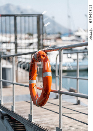 Orange rescue circle at the Yacht Club Rescue buoy 67946315