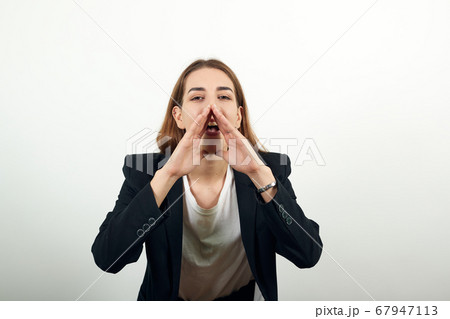 Scream and shout Holding hands near opened mouth. Screaming loudly with hand 67947113