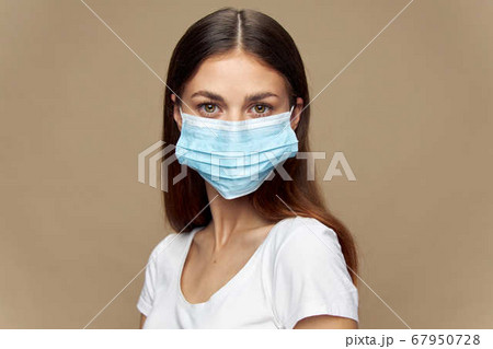 Girl stylish clothes in a protective mask  67950728
