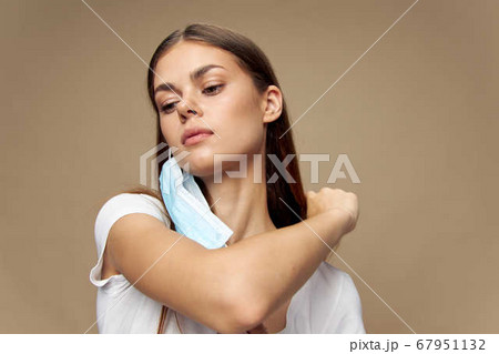 Model in white shirt in a medical mask health Model in white shirt in a medical mask health 67951132