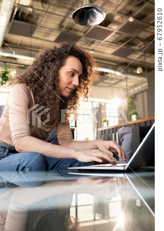 Surfing net on laptop in cafe Surfing net on laptop in cafe 67952610