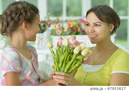 Cute girl prepared surprise to her mother Cute girl prepared surprise to her mother 67953627