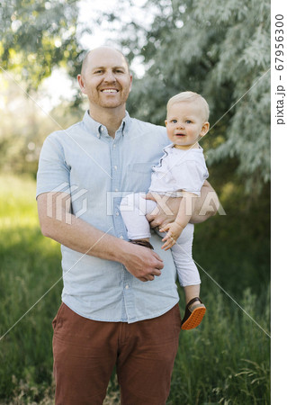 Outdoor portrait of father with baby son 67956300