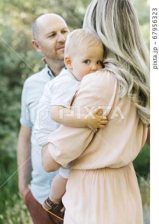 Mother and father with their baby son 67956323