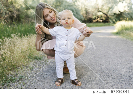 Outdoor portrait of mother with baby son 67956342