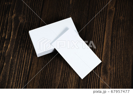 Blank business cards on wooden working table with Blank business cards on wooden working table with 67957477