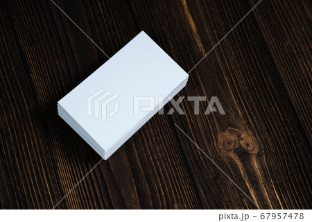 Blank business cards on wooden working table with 67957478