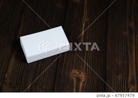 Blank business cards on wooden working table with 67957479