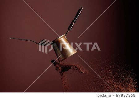 Old copper coffee maker and a spoon with ground Old copper coffee maker and a spoon with ground 67957559