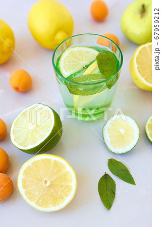 Tasty lemonade or mojito cocktail with lemon and lime. 67959212