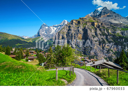 Murren mountain resort with high snowy mountains in background, Switzerland Murren mountain resort with high snowy mountains in background, Switzerland 67960033