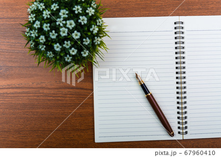 Fountain pen or ink pen with notebook paper and Fountain pen or ink pen with notebook paper and 67960410