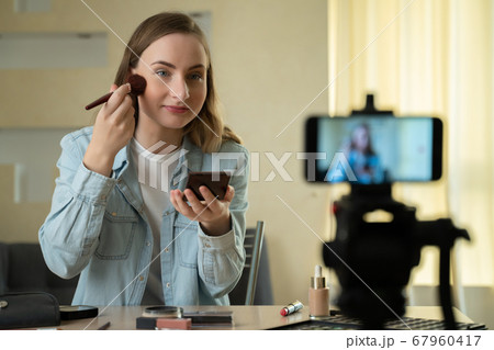 Female blogger making a video for her beauty blog on cosmetics. 67960417
