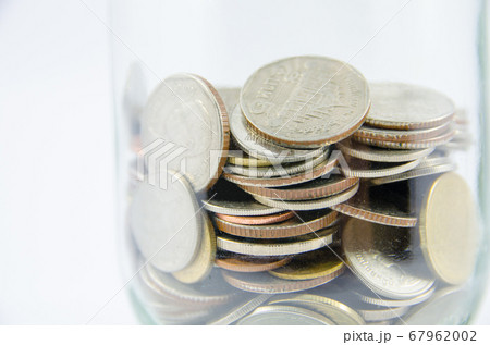 close up of thai coin in glass bottle on isolated 67962002