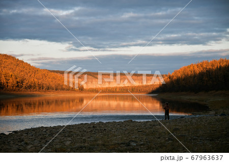 Evening fishing on the Siberian taiga river Evening fishing on the Siberian taiga river 67963637