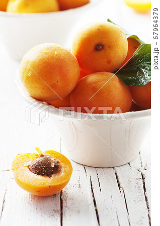 Fresh sweet apricots on the wooden table 67964379