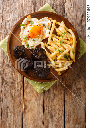 Spanish cuisine fried egg with fries and blood Spanish cuisine fried egg with fries and blood 67965643