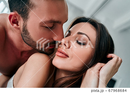 The attractive man and woman kissing The attractive man and woman kissing 67968684
