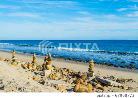 Stone piles in Malibu shoreline 67968772
