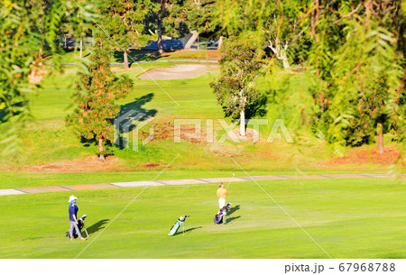 playing golf on a sunny day playing golf on a sunny day 67968788