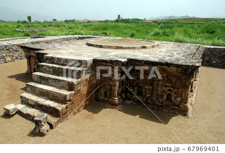 Sirkap, Punjab, Pakistan. Sirkap is an ancient archaeological site and part of the ancient city of Taxila. Taxila is recognized by UNESCO. Double headed eagle stupa at Sirkap, Taxila, Pakistan. 67969401