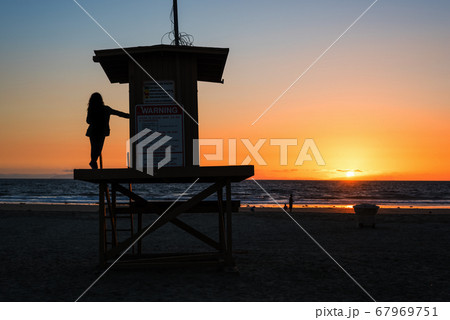 girl on a lifeguard tower in Newport Beach at 67969751