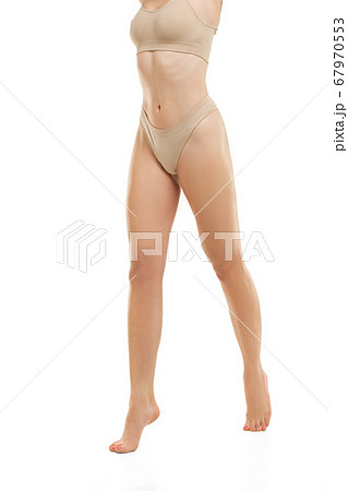 Beautiful female legs, buttlocks and belly isolated on white background. Sportive, sensual body with well-kept skin in underwear. Beautiful female legs, buttlocks and belly isolated on white background. Sportive, sensual body with well-kept skin in underwear. 67970553