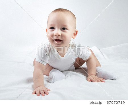 Image of a nine-month-old child on a white background Image of a nine-month-old child on a white background 67970719