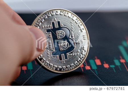 Close-up photo of crypto coin in hands. Bitcoin economy. Close-up photo of crypto coin in hands. Bitcoin economy. 67972781