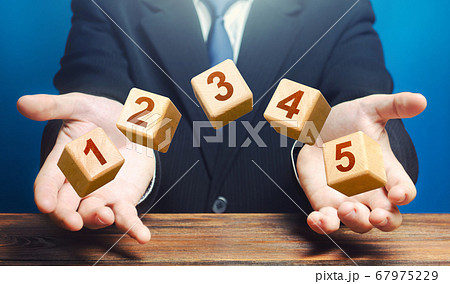 Man throws 5 numbered blocks with the numbers one two three four five from his hands. Five easy steps. Organization and systematization, step by instructions. Business planning, action plan. Man throws 5 numbered blocks with the numbers one two three four five from his hands. Five easy steps. Organization and systematization, step by instructions. Business planning, action plan. 67975229