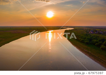 Panorama of the Akhtuba River in the Astrakhan region. Sunset on the pond. 67975397