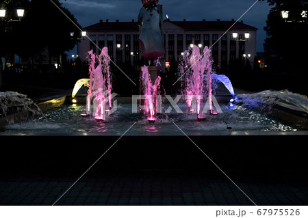 Colored lighting in the fountain at night Colored lighting in the fountain at night 67975526