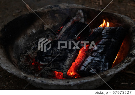 Coals of a bonfire in a basin Coals of a bonfire in a basin 67975527