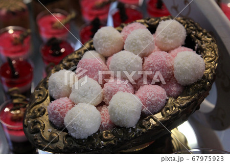 Colorful desserts and pastry served on a wedding party Colorful desserts and pastry served on a wedding party 67975923