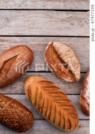 Bread on rustic wooden background. Bread on rustic wooden background. 67977209