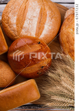 Healthy artisan bread and wheat ears. 67977232