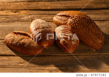Bread on rustic wooden background. Bread on rustic wooden background. 67977283