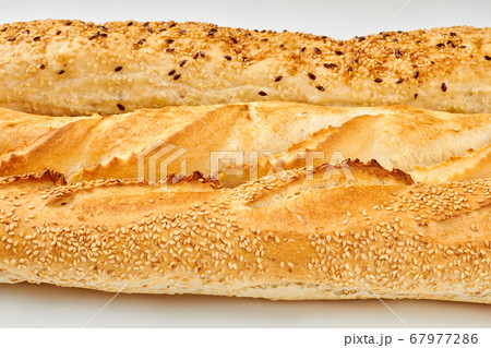 Close up of crusty baguettes with sesame and flax seeds. Close up of crusty baguettes with sesame and flax seeds. 67977286