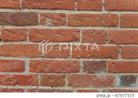 red brick wall texture grunge background with vignetted corners, may use to interior design. red brick wall texture grunge background with vignetted corners, may use to interior design. 67977535