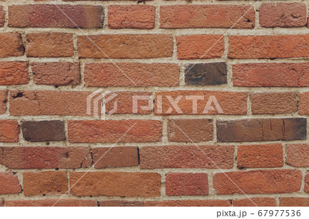 red brick wall texture grunge background with vignetted corners, may use to interior design. red brick wall texture grunge background with vignetted corners, may use to interior design. 67977536