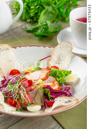 Fresh salad with chicken breast, arugula and tomato. Top view 67978433