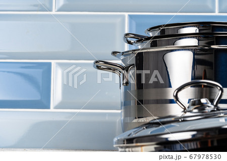 Close up photo of cookware set on kitchen counter Close up photo of cookware set on kitchen counter 67978530