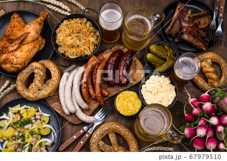 Oktoberfest dishes with beer, pretzel and sausage 67979510