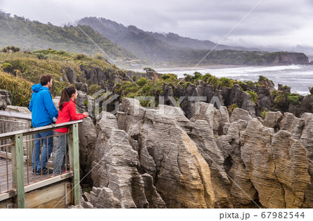 Punakaiki Pancake Rocks tourists couple travel in Paparoa National Park, West Coast, South Island, New Zealand 67982544